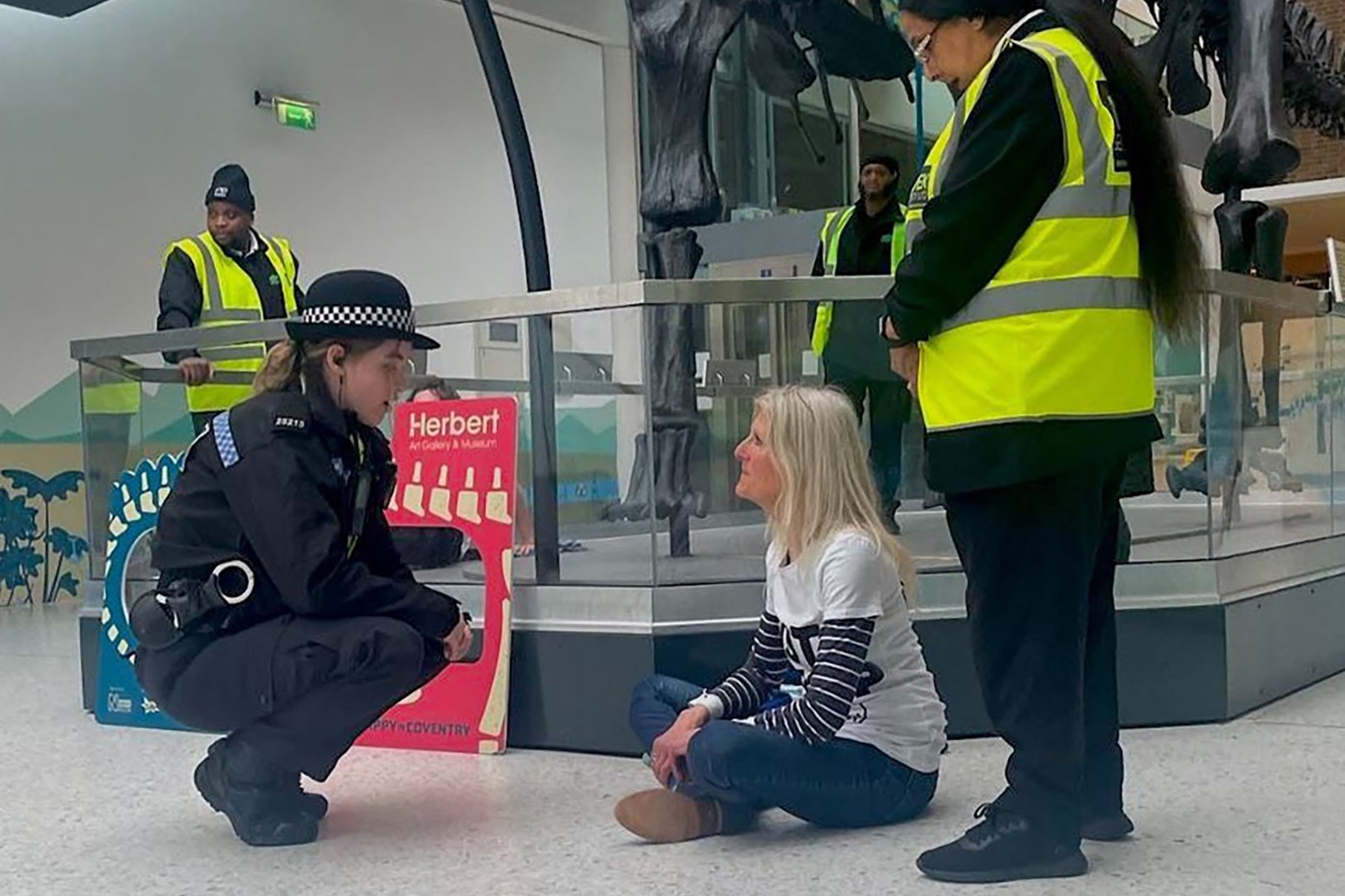 Protesters clash with museum security guards in dinosaur display 